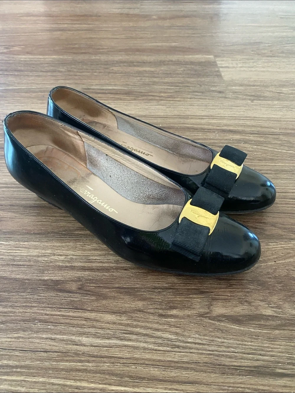 Salvatore Ferragamo Vara leather pumps black grosgrain bow gold-tone hardware.